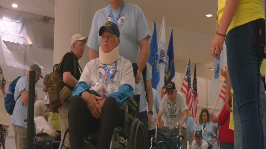 Military vet from Louisville pushed through crowds in wheelchair at Louisville airport