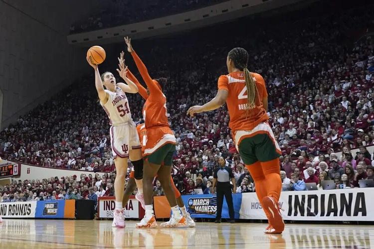 Indiana's Mackenzie Holmes shoots against Miami's Kyla Oldacre.jpg