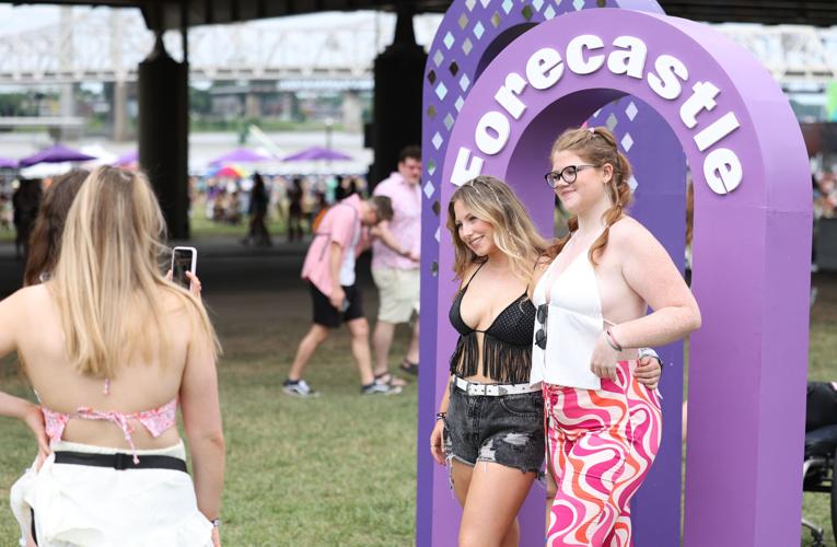 Two girls take a photo at the Forecastle sign.JPG