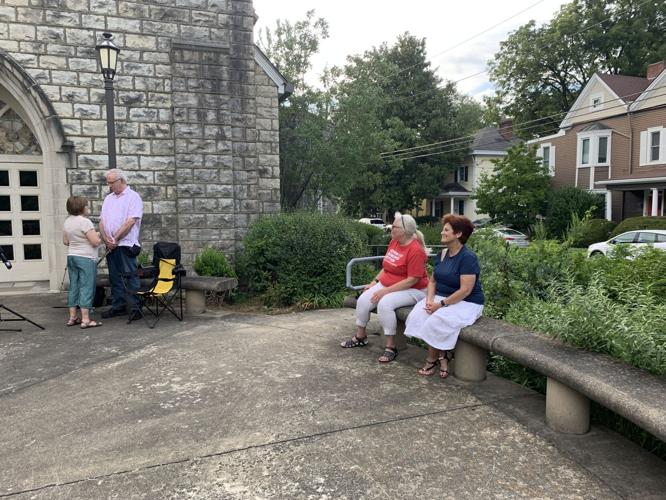 People sit at vigil at Crescent Hill church