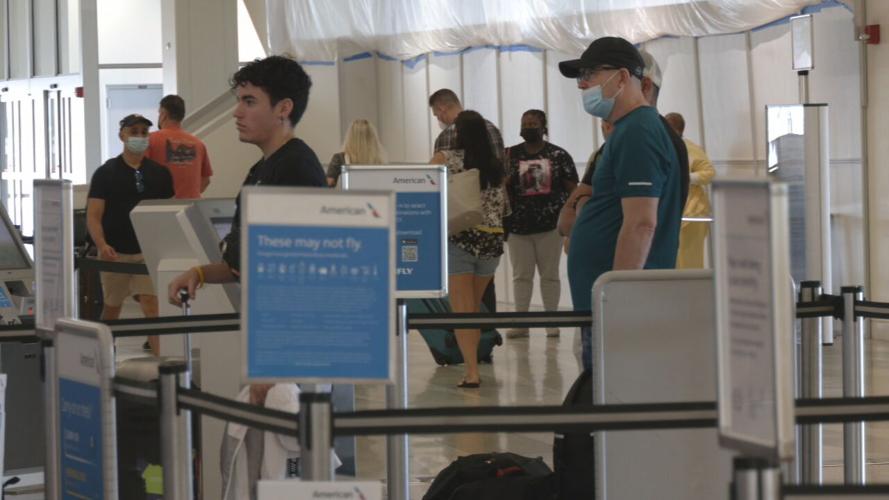 Travelers waiting at security checkpoint at Louisville Muhammad Ali International Airport