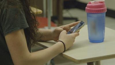 Student on cellphone generic