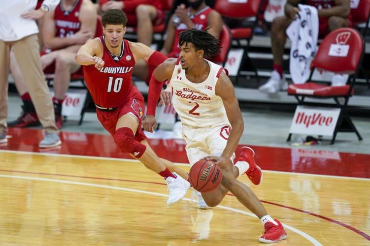 Wisconsin's Aleem Ford (2) drives against Louisville's Samuell Williamson