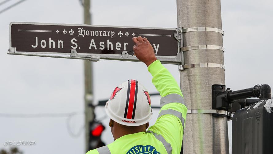 Man tightens sign.jpg