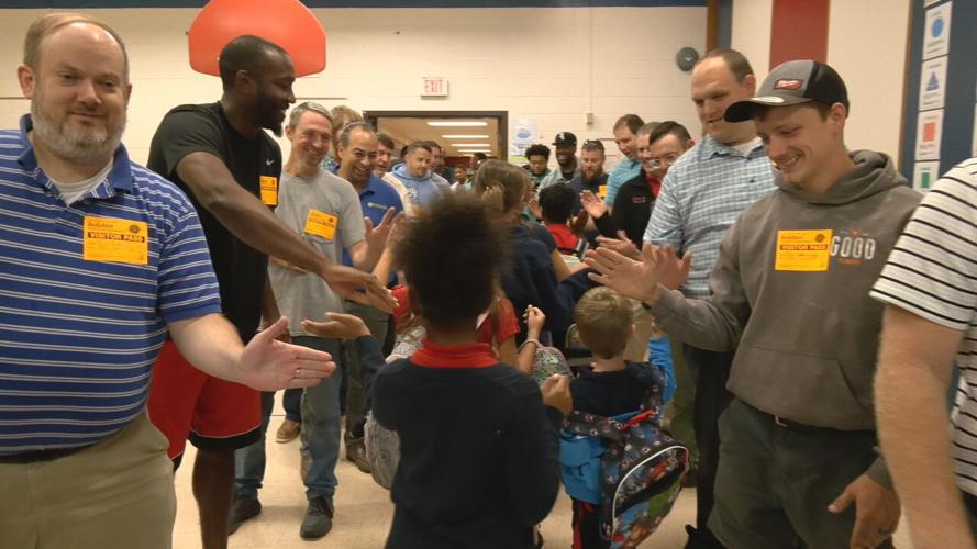 'Flash dads' greet JCPS students before classes at Audubon Elementary School