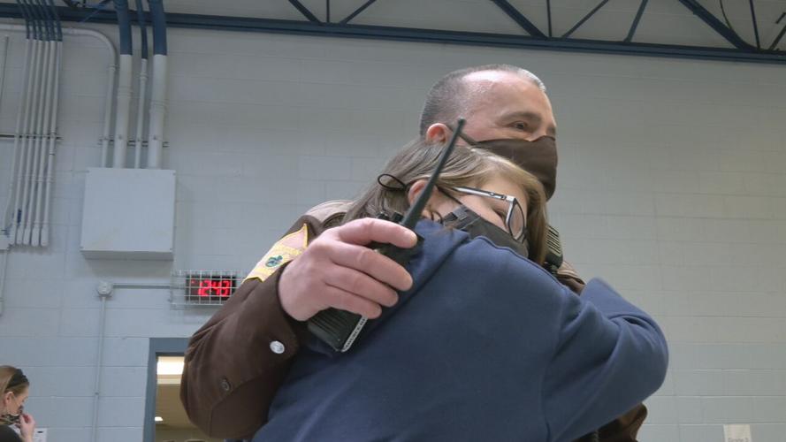 Silver Creek Elementary student hugs School Resource Officer Tim Tillett