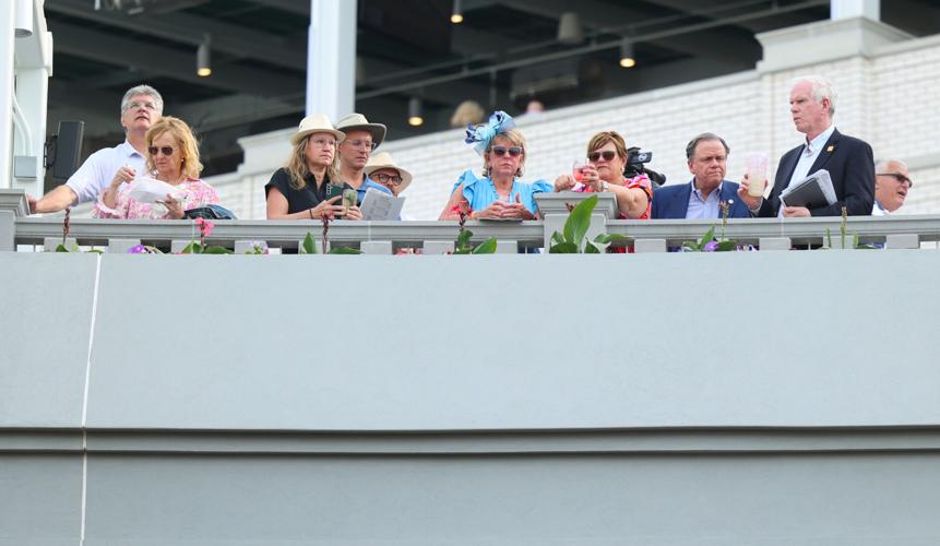 People look down on the Paddock Club.JPG