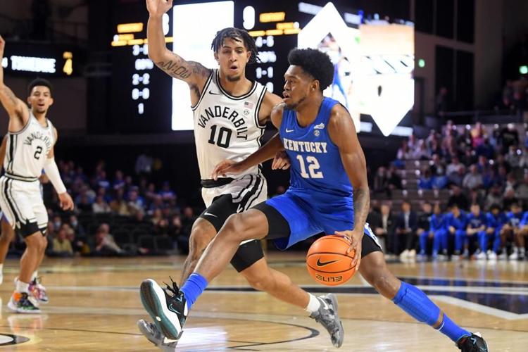 Kentucky forward Keion Brooks Jr. drives as a Vanderbilt forward Myles Stute defends.jpeg