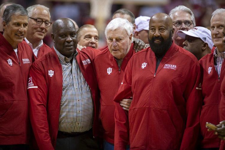 Bob Knight surrounded by former players and staff