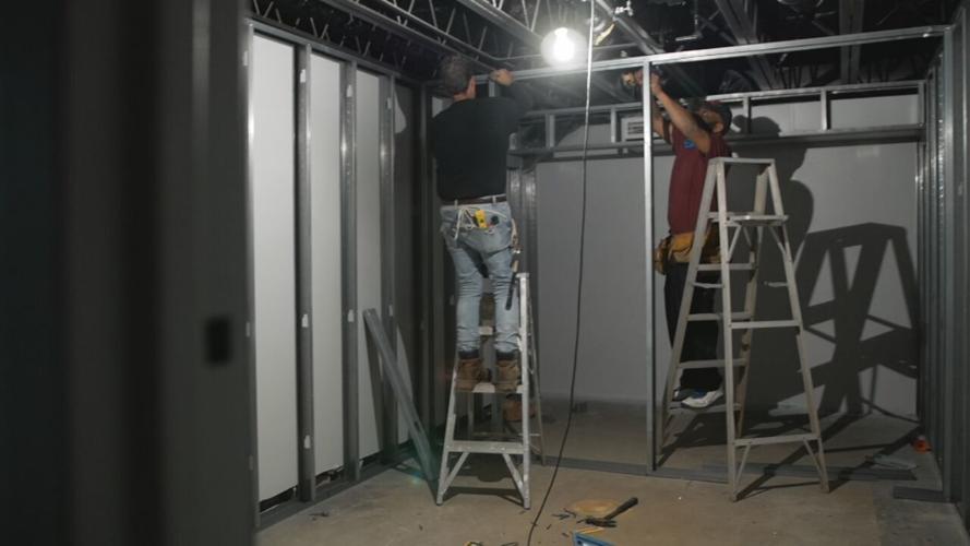 People working on music studio in Portland neighborhood