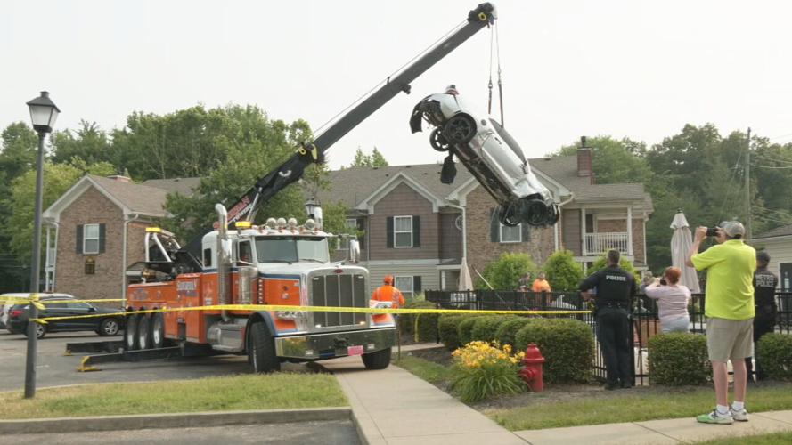 Crane lifts car from south Louisville pool after fatal shooting