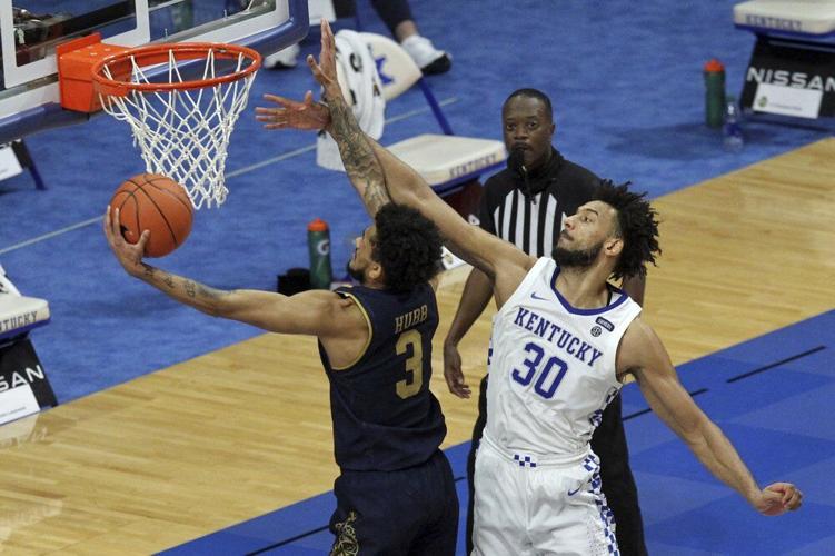 Notre Dame's Prentiss Hubb (3) shoots while defended by Kentucky's Olivier Sarr