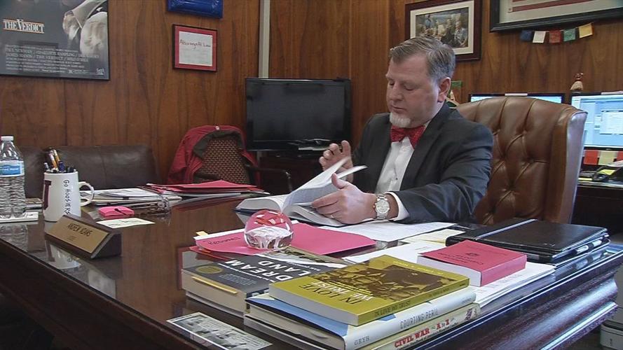 JUDGE ANDREW ADAMS INTERVIEW 4PKG.transfer_frame_7608 desk close-up.jpg