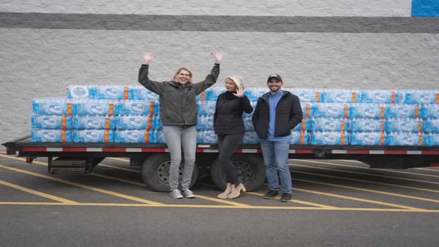 HealthyR workers near truckload of donated water