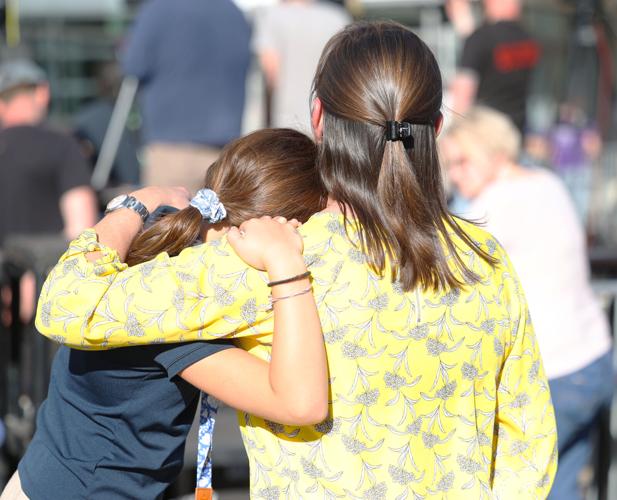 Two people embrace during vigil.JPG