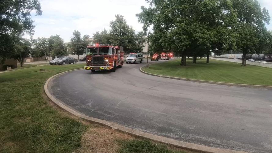 A procession for Sgt. Kyle Adams with the Fern Creek Fire Department