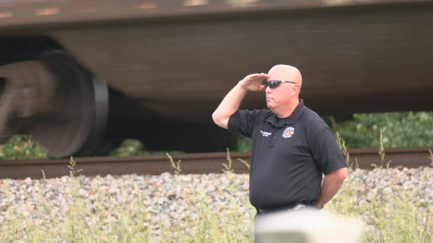 A procession for Sgt. Kyle Adams with the Fern Creek Fire Department