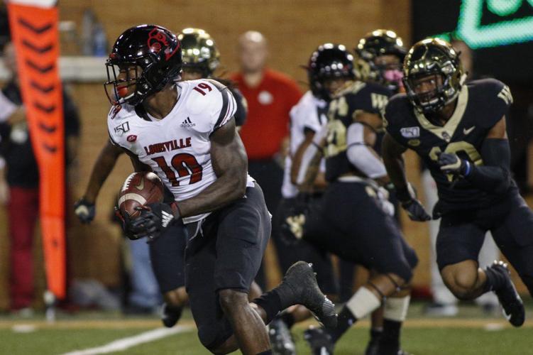 Hassan Hall (19) returns a kickoff for a touchdown