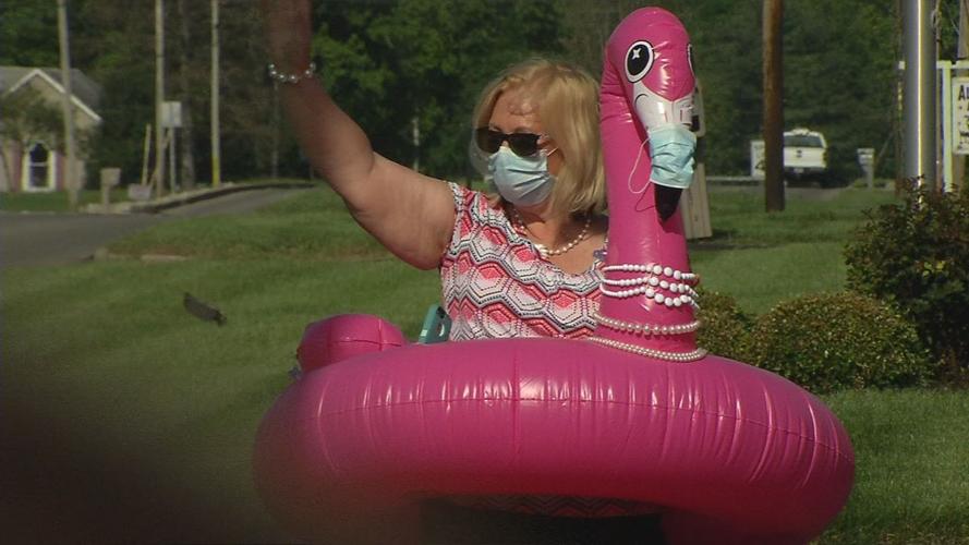 Madison Assembly of God churchgoers wear pool floats on the first Sunday back during COVID-19 pandemic to remind people to be socially distant, pink flamingo float with mask