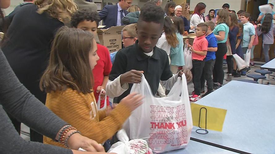 Students at Camp Taylor Elementary School volunteered Thursday to help fill bags with food for Blessings in a Backpack