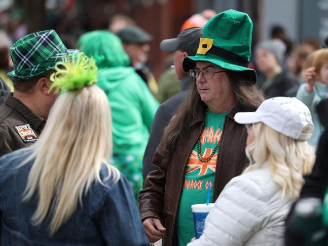 Man in hat talks at parade