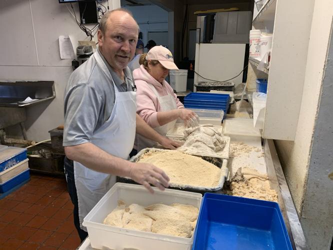 The Hungry Pelican owner, Al Feige, prepares fish
