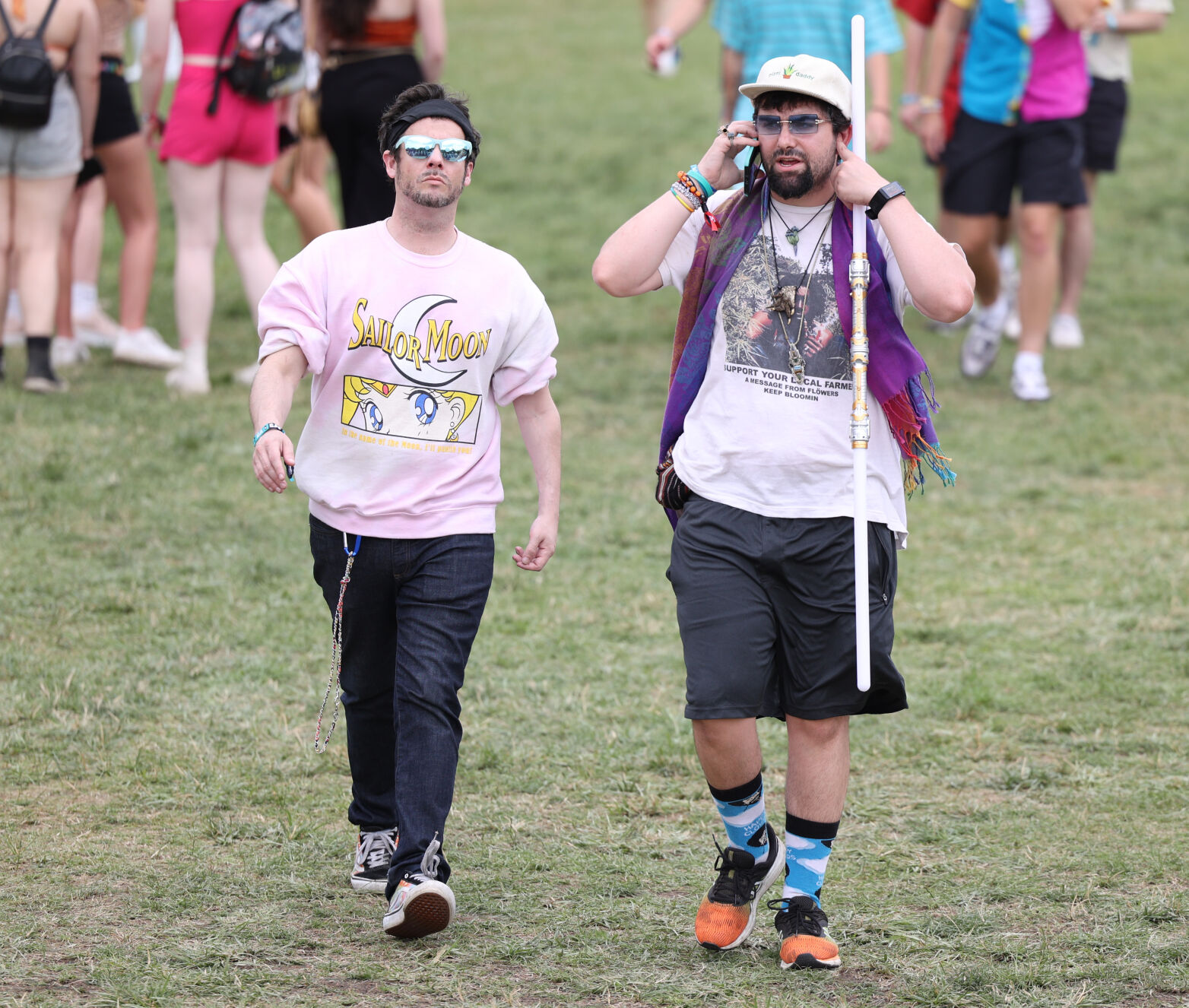 Two people walk toward a bridge at Forecastle.JPG