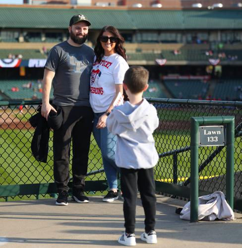 Boy takes photo of couple at Slugger Field.JPG