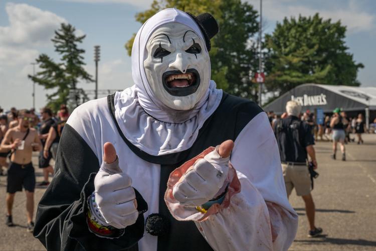 A fan stops for a photo between crowd surfing and posing for photos at the Louder Than Life Festival on September, 21, 2025 in Louisville, Kentucky (73 of 175).jpg
