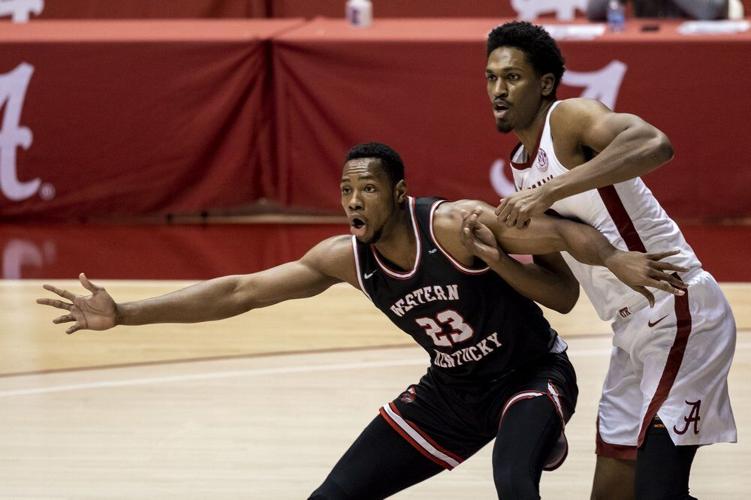 Western Kentucky center Charles Bassey (23) and Alabama guard Joshua Primo