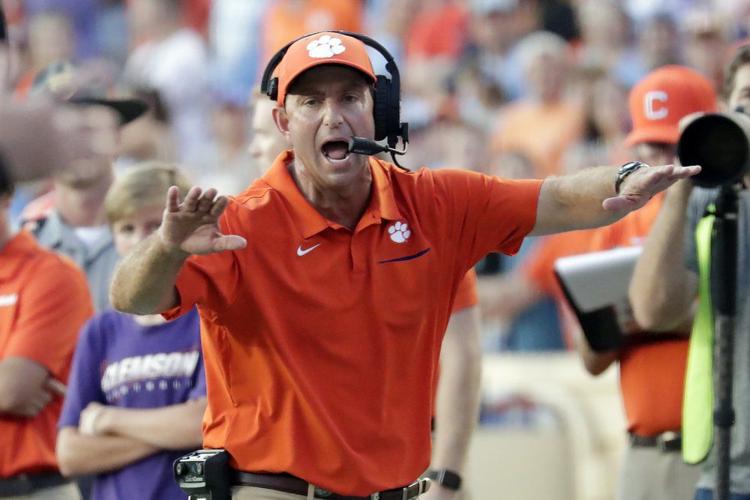 Clemson head coach Dabo Swinney yells to an official