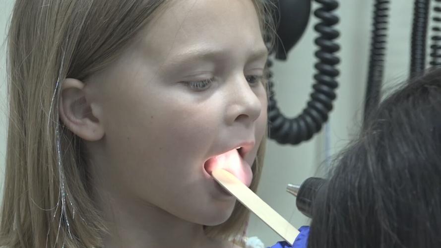 Child patient and doctor during child's annual physical