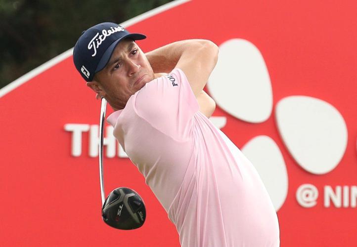 Justin Thomas of the United States watches his shot