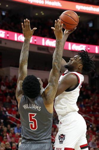 North Carolina State's DJ Funderburk (0) shoots over Louisville's Malik Williams