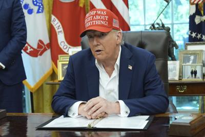 Trump with hat in Oval 8-22-2025