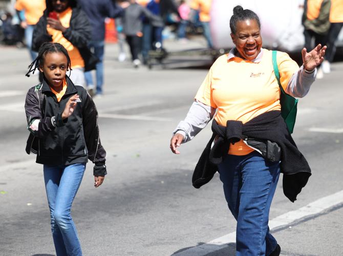 Two walks smile at crowd.JPG