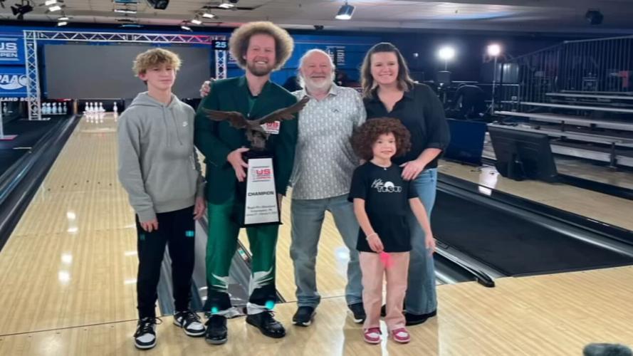 Kyle Troup poses with his family