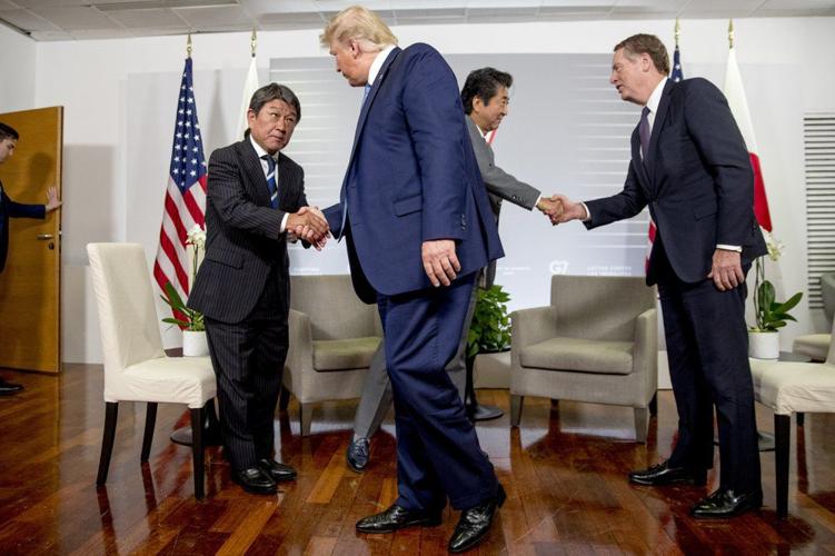 g7 shaking hands ap.jpeg
