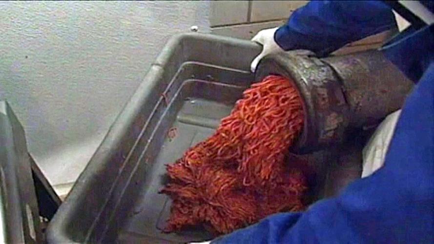 Ground beef coming out of spout.