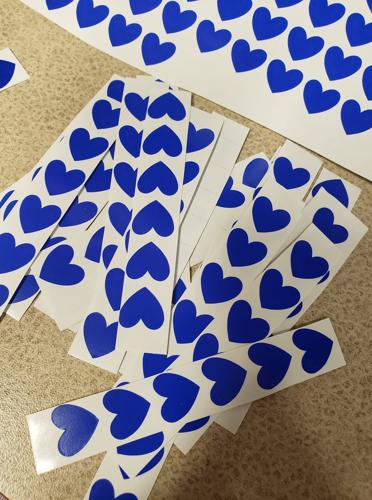 Louisville health care workers make blue heart stickers to celebrate 'healthcare heroes'