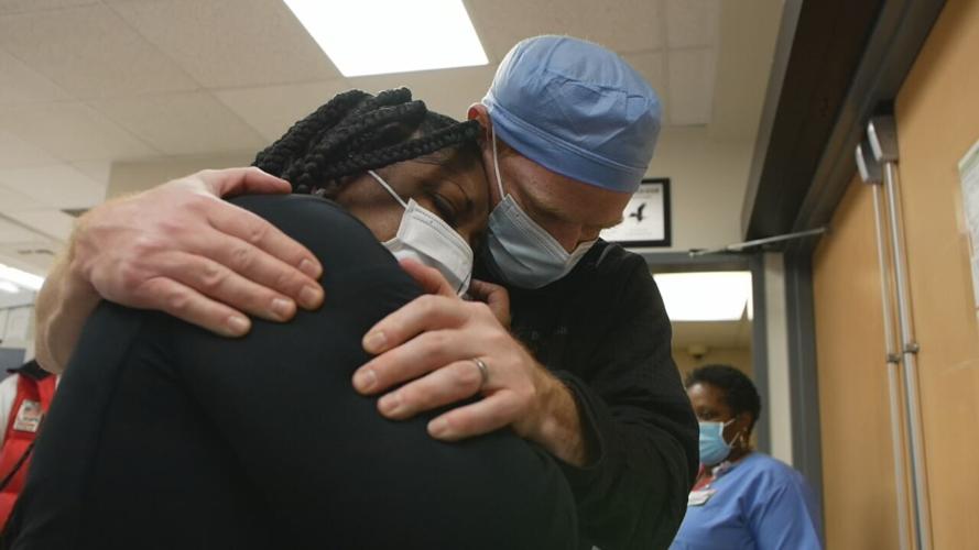 mother and doctor embrace