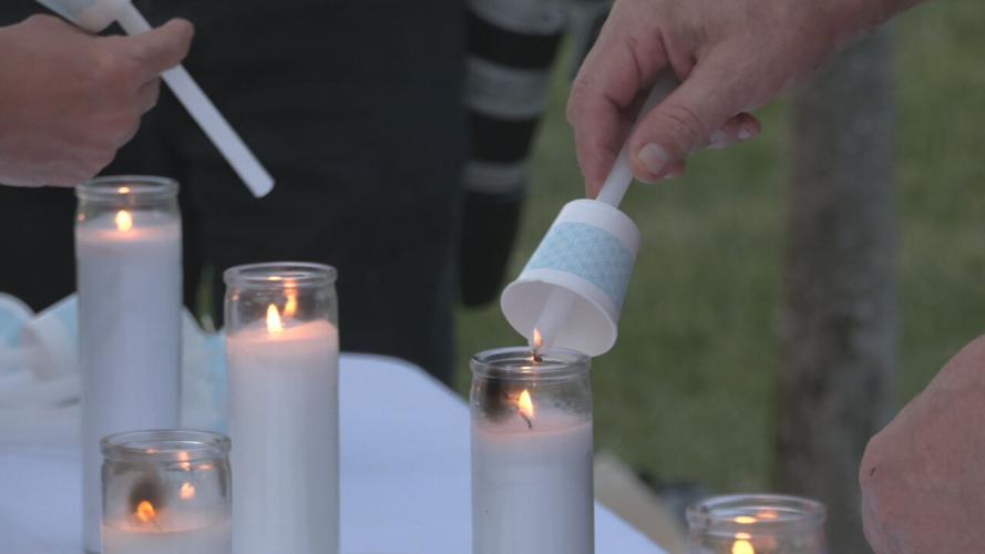 Candles being lit at Prayer Vigil for Big Four Bridge.jpeg