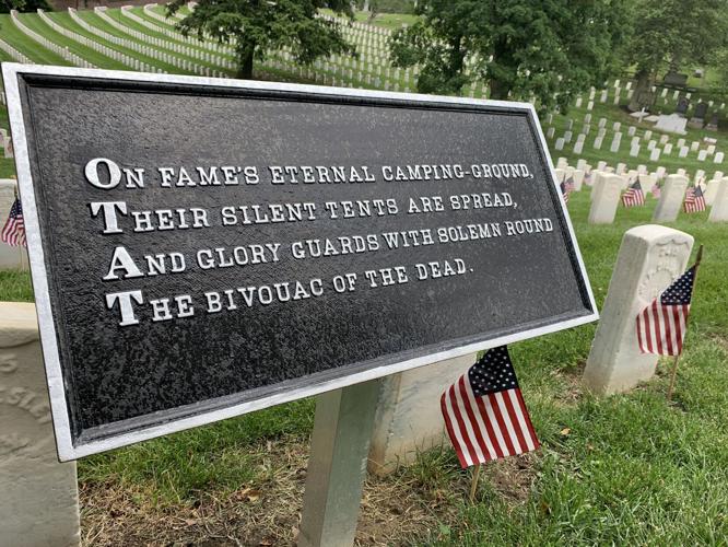 Flags placed on the graves of veterans at Cave Hill Cemetery on Friday, May 27, 2022