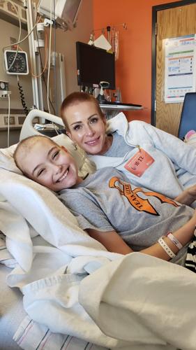 Alexis Bibb poses with mom from hospital bed