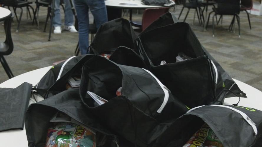 Duke Energy volunteer pack bags for Blessings in a Backpack