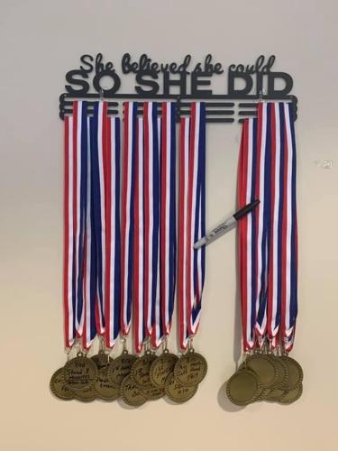 PARALYZED WOMAN REHAB - Medals mark journey to recovery