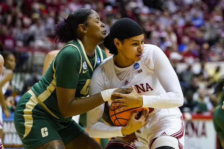 Indiana forward Kiandra Browne gets tied up by Charlotte forward Keke McKinney.jpeg