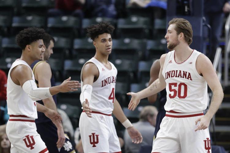 Indiana's Joey Brunk (50) is congratulated by Justin Smith (3) and Trayce Jackson-Davis