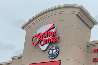 Guitar Center logo on store