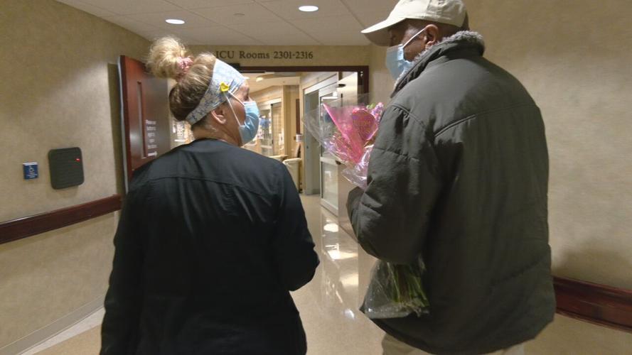 Marcus Daniels, of Jeffersonville, thanks a Baptist Health Floyd staff member for helping him survive COVID-19